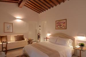 Posteľ alebo postele v izbe v ubytovaní Villa I Barronci Resort & Spa
