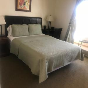 Postel nebo postele na pokoji v ubytování Bella Capri Inn and Suites