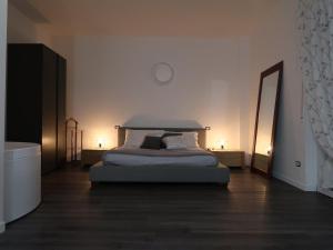 A bed or beds in a room at Romeo&Juliet's Nest in Verona