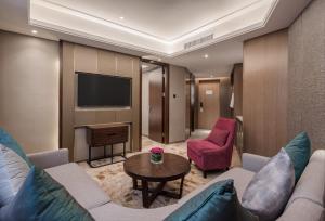 Uma televisão e/ou sistema de entretenimento em Wuhan Hongguang Hotel