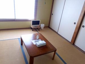 TV a/nebo společenská místnost v ubytování Guest House Shiraishi