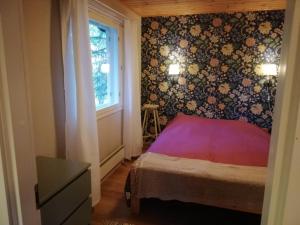 Postel nebo postele na pokoji v ubytování Tikkamäki