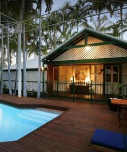 
a house with a pool and a fire place at Pinctada McAlpine House in Broome
