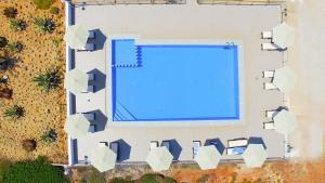 an overhead view of a swimming pool in a building at Nanakis Beach Apartments in Stavros