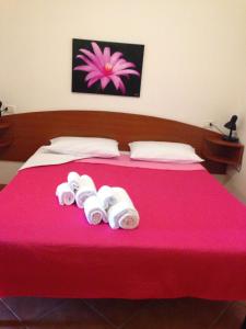 A bed or beds in a room at Villa Marilena