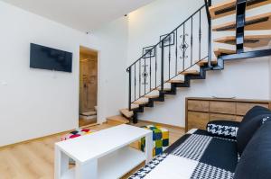 TV a/nebo společenská místnost v ubytování Rooms Baza