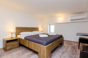 Postel nebo postele na pokoji v ubytování Rooms Baza