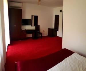 Postel nebo postele na pokoji v ubytování Hotel Hermes