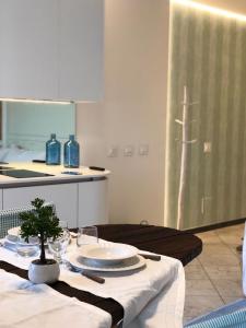 a table with plates on it in a kitchen at Vongola in Portovenere +59 photos