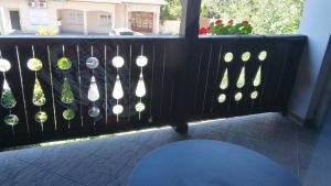 a fence with a bunch of potted plants on it at Dunakanyar Bed & Breakfast Panzio in Göd +3 photos