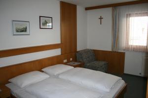 Postel nebo postele na pokoji v ubytování Pension Schipflinger