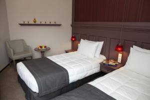 Postel nebo postele na pokoji v ubytování Rodopi Hotel
