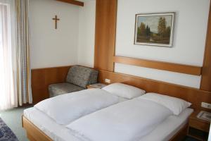 Postel nebo postele na pokoji v ubytování Pension Schipflinger
