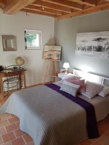 a bedroom with a large bed in a room at La Ruette aux Loups in Collonges-au-Mont-dʼOr