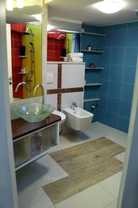 a bathroom with a sink and a toilet at Apartments Prestige in Split