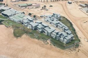 an aerial view of a large estate with houses at First Group Desert Rose in Hentiesbaai +18 photos