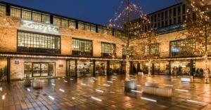 a large building with christmas lights in a courtyard at Studio in heart of Warsaw in Warsaw