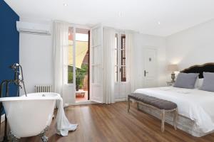 A bed or beds in a room at Gracia 1872