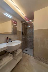 a bathroom with a sink and a shower at Ca' de la Fonte - WENICE Deep Culture in Venice