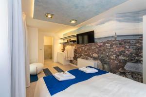 a bedroom with a large view of a city at Ca' de la Fonte - WENICE Deep Culture in Venice