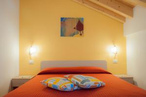 A bed or beds in a room at b&b Casa Tavernaro