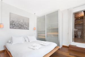 Posteľ alebo postele v izbe v ubytovaní Atic Barcelona