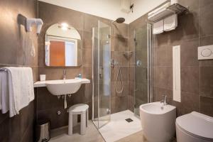 Kúpeľňa v ubytovaní Hotel Delfino