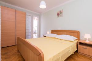 Ein Bett oder Betten in einem Zimmer der Unterkunft Apartments Mirko&Ana