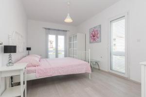 Ein Bett oder Betten in einem Zimmer der Unterkunft Apartments Mirko&Ana