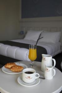 Postel nebo postele na pokoji v ubytování Rodopi Hotel