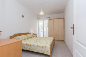 Ein Bett oder Betten in einem Zimmer der Unterkunft Apartments Mirko&Ana