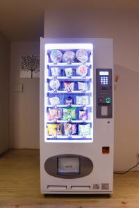 a white refrigerator with food inside of it at D.Y. Hotel in Taichung