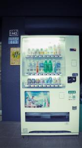 a refrigerator filled with drinks and milk in a store at D.Y. Hotel in Taichung