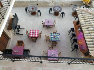 an overhead view of a patio with tables and chairs at Hanna Koumi Boutique Hotel in Kormakiti