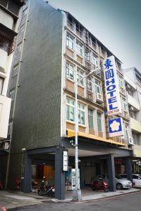 a building with a sign on the side of it at D.Y. Hotel in Taichung