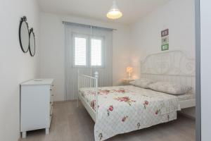 Ein Bett oder Betten in einem Zimmer der Unterkunft Apartments Mirko&Ana
