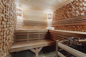 
a wooden building with wooden floors and wooden walls at Boutique Hotel California in Odesa
