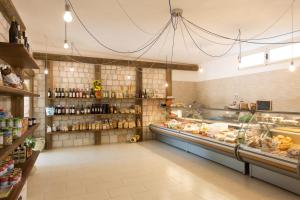 a store aisle with a counter in a store at Village Baia Turchese in Vieste