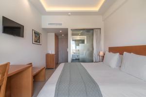 Postel nebo postele na pokoji v ubytování Hotel Palmyra