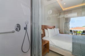 Postel nebo postele na pokoji v ubytování Hotel Palmyra