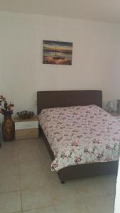 Voodi või voodid majutusasutuse Rooms Sijak toas
