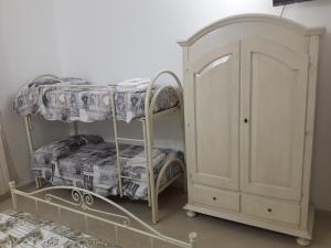 Postel nebo postele na pokoji v ubytování B&b Giadà