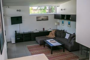 a living room with a couch and a table at Villa Andrej in Liptovský Mikuláš