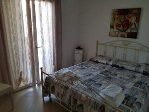 Postel nebo postele na pokoji v ubytování B&b Giadà