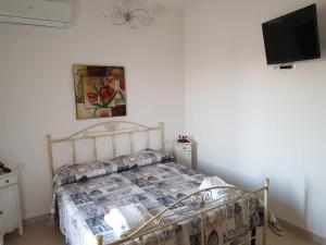 Postel nebo postele na pokoji v ubytování B&b Giadà