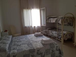 Postel nebo postele na pokoji v ubytování B&b Giadà