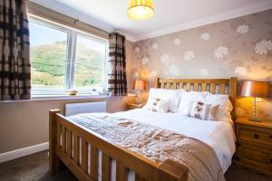 Katil atau katil-katil dalam bilik di Lochside Guest House
