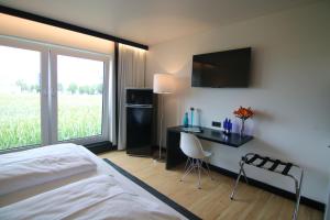 Postel nebo postele na pokoji v ubytování LH Hotel by WMM Hotels