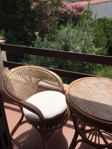 A balcony or terrace at La ginestra Chia B&B