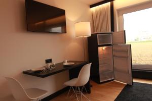 Kuchyň nebo kuchyňský kout v ubytování LH Hotel by WMM Hotels